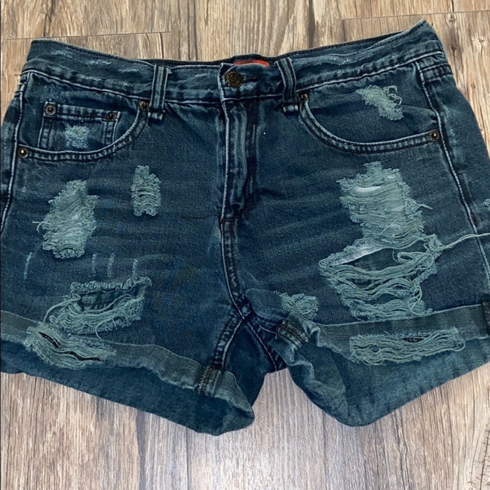 Black ripped shorts.